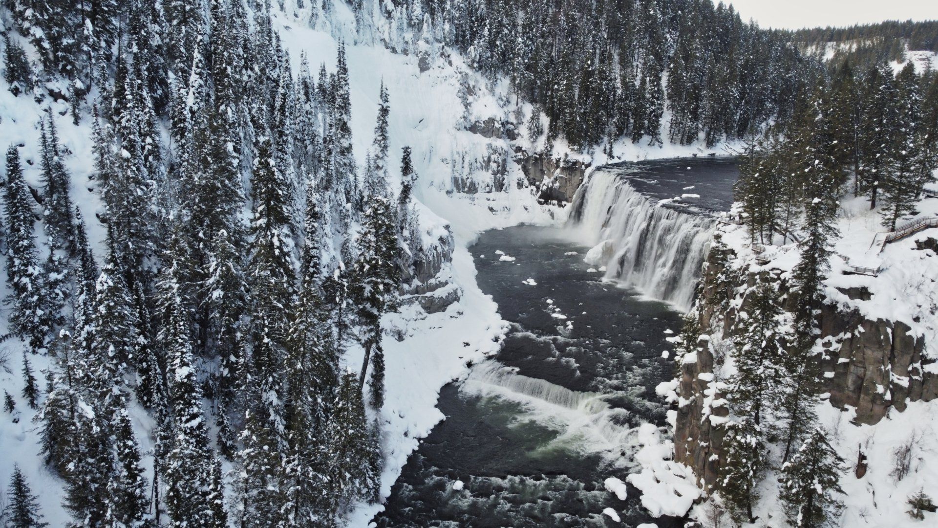 Snowy mountainside and waterfall