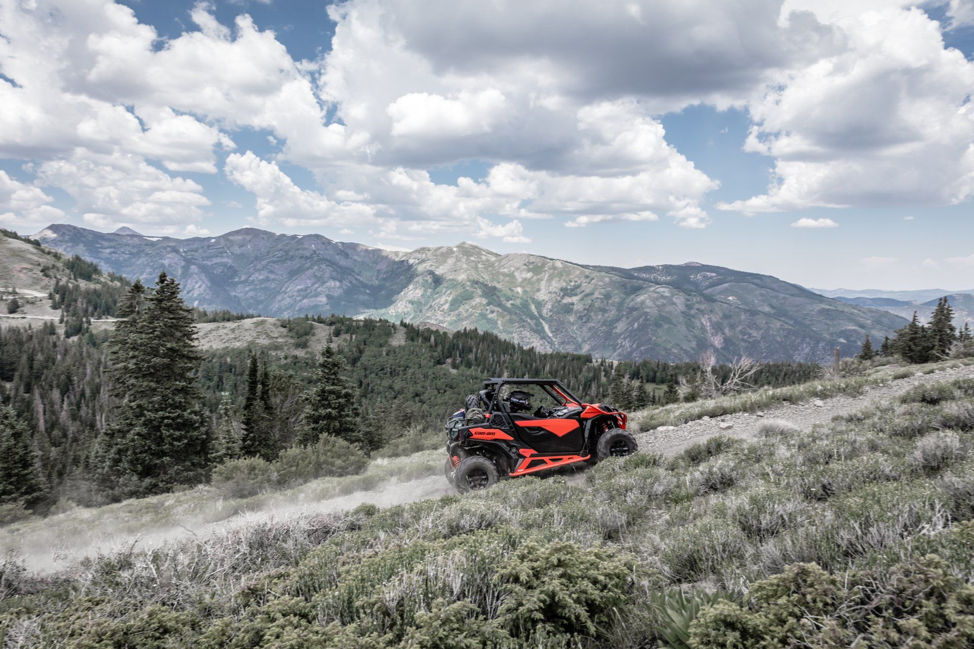Red UTV on mountain trail