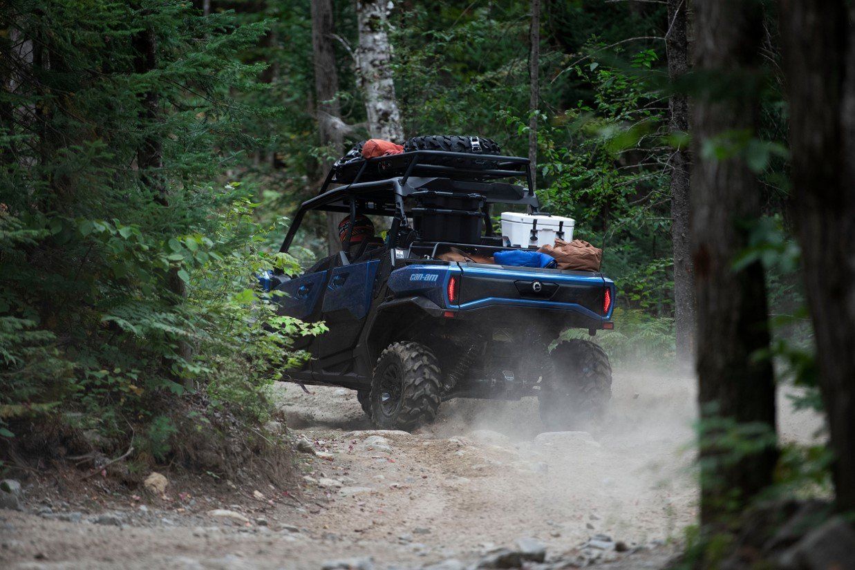 blue UTV/ATV on dirt trail