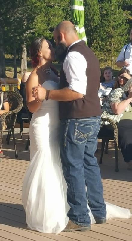 Newly weds dancing in front of their guests