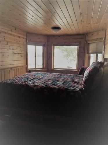 Bedroom with three windows