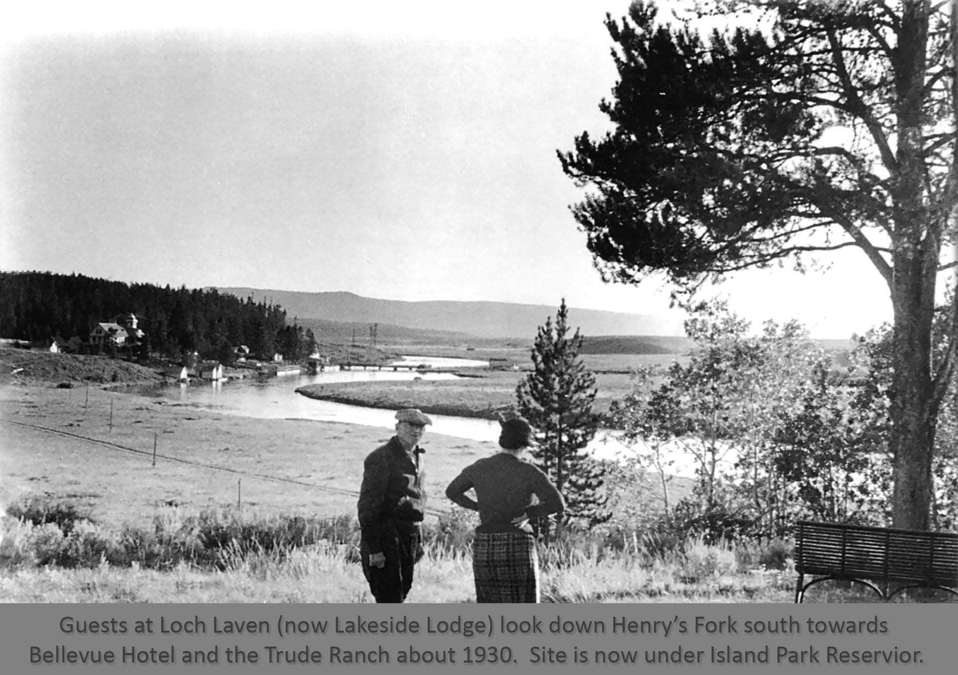 black and white couple standing on hill near river