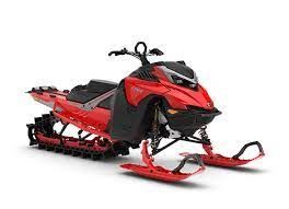 Two white snowmobiles