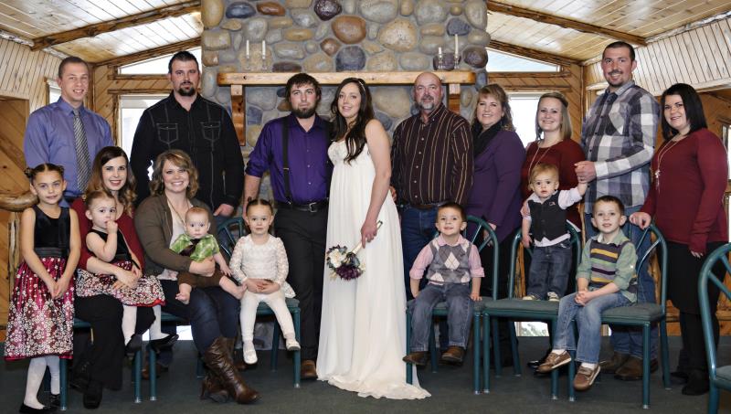 Newly wedded couple with their families