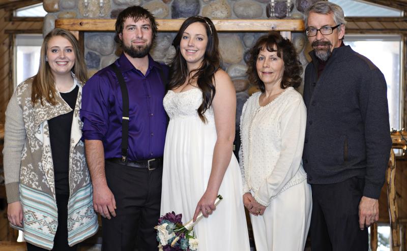 Newly wedded couple with their parents