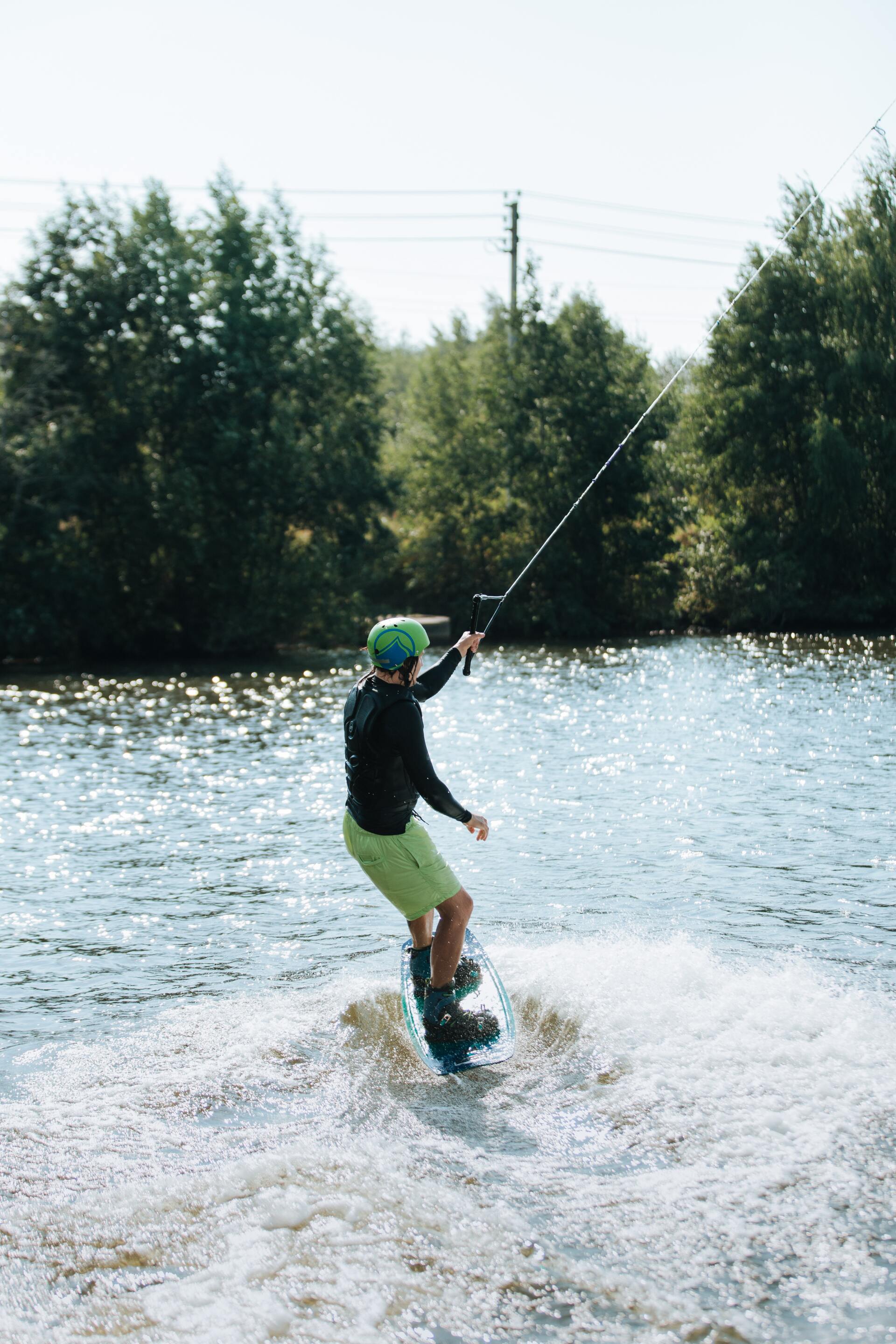 A man wakeboarding on a lake