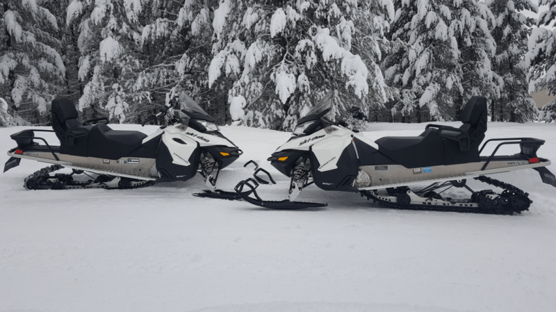 Two black and white jet skis