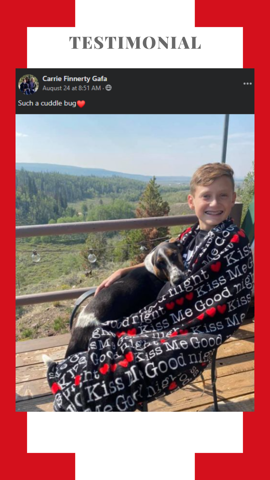 A boy is sitting on a bench with a dog wrapped in a blanket.