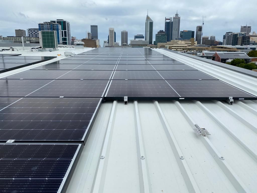 A roof with a lot of solar panels on it