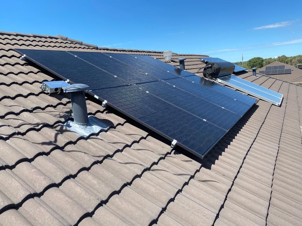 A roof with a lot of solar panels on it