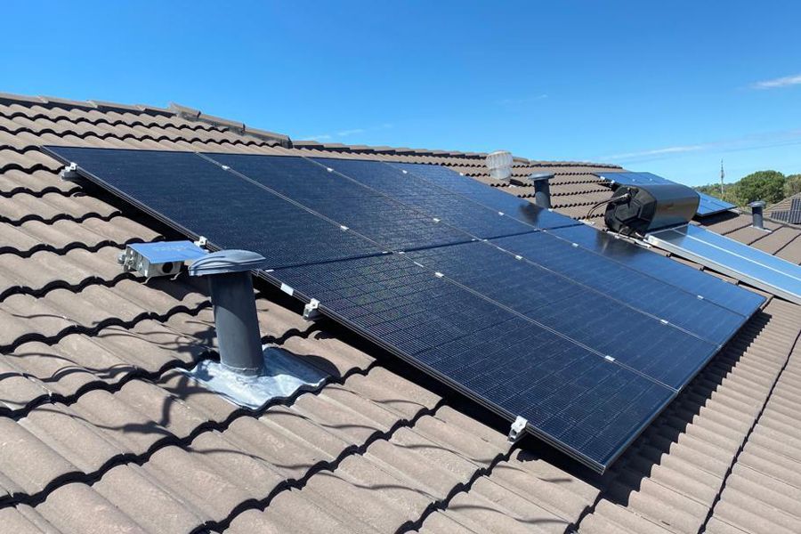 A roof with a lot of solar panels on it