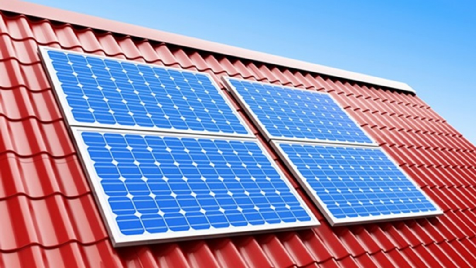 Four solar panels are mounted on a red tiled roof