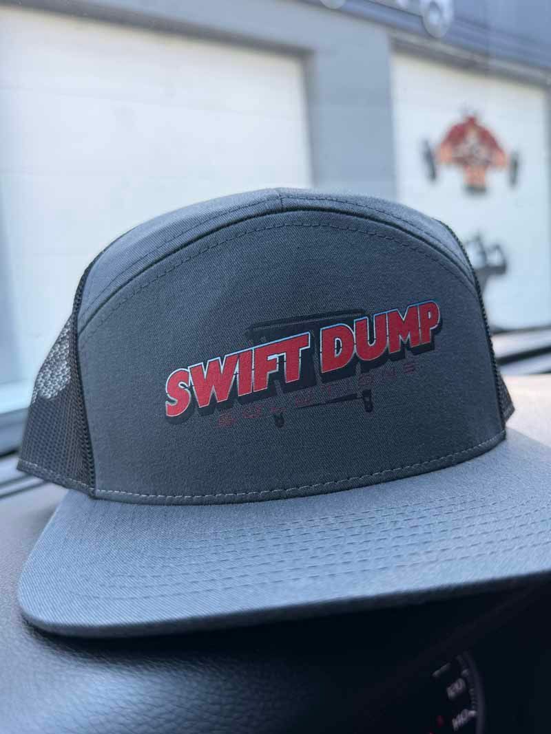 Black trucker hat with gray brim and red “SWIFT DUMP” lettering