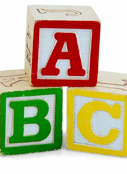 Colorful alphabet blocks with letters A, B, and C on a white background