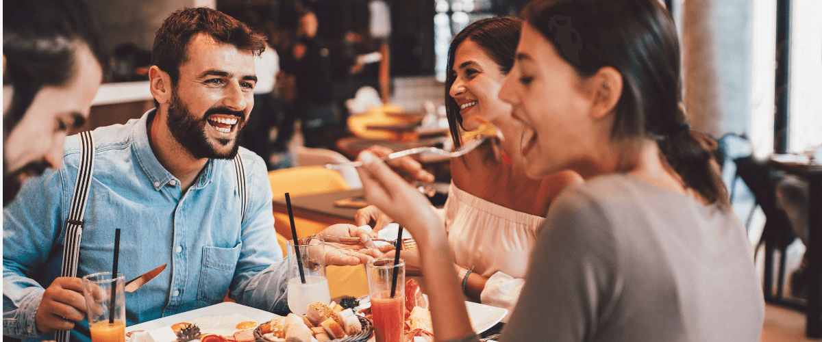 three people eating food
