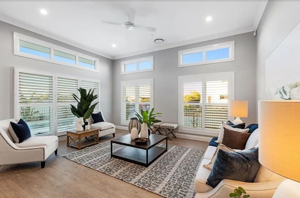 A Living Room Filled With Furniture And A Ceiling Fan — Norm Evans Floors Pty Ltd in Kunda Park, QLD