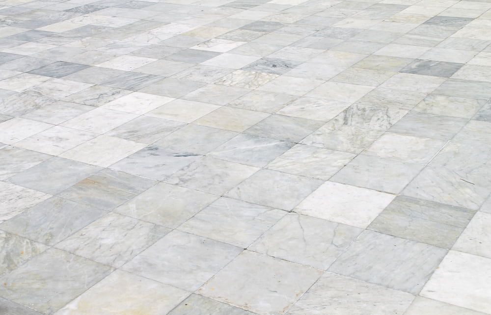 A Close Up Of A Marble Floor With Square Tiles — Norm Evans Floors Pty Ltd in Kunda Park, QLD