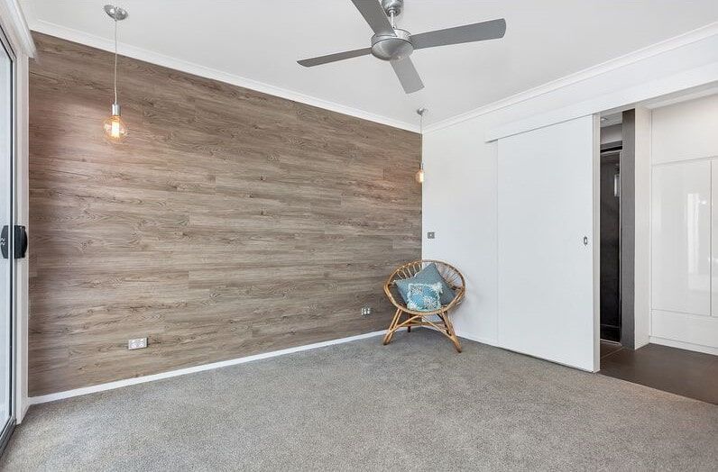 There Is A Chair In The Middle Of The Room With A Ceiling Fan — Norm Evans Floors Pty Ltd in Kunda Park, QLD