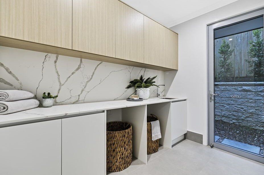 A Laundry Room With A Large Window And A Sliding Glass Door — Norm Evans Floors Pty Ltd in Kunda Park, QLD
