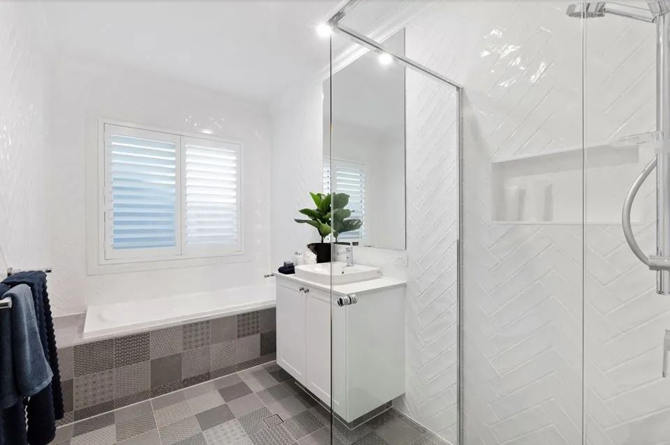A Bathroom With A Walk In Shower , Sink , And Tub — Norm Evans Floors Pty Ltd in Kunda Park, QLD