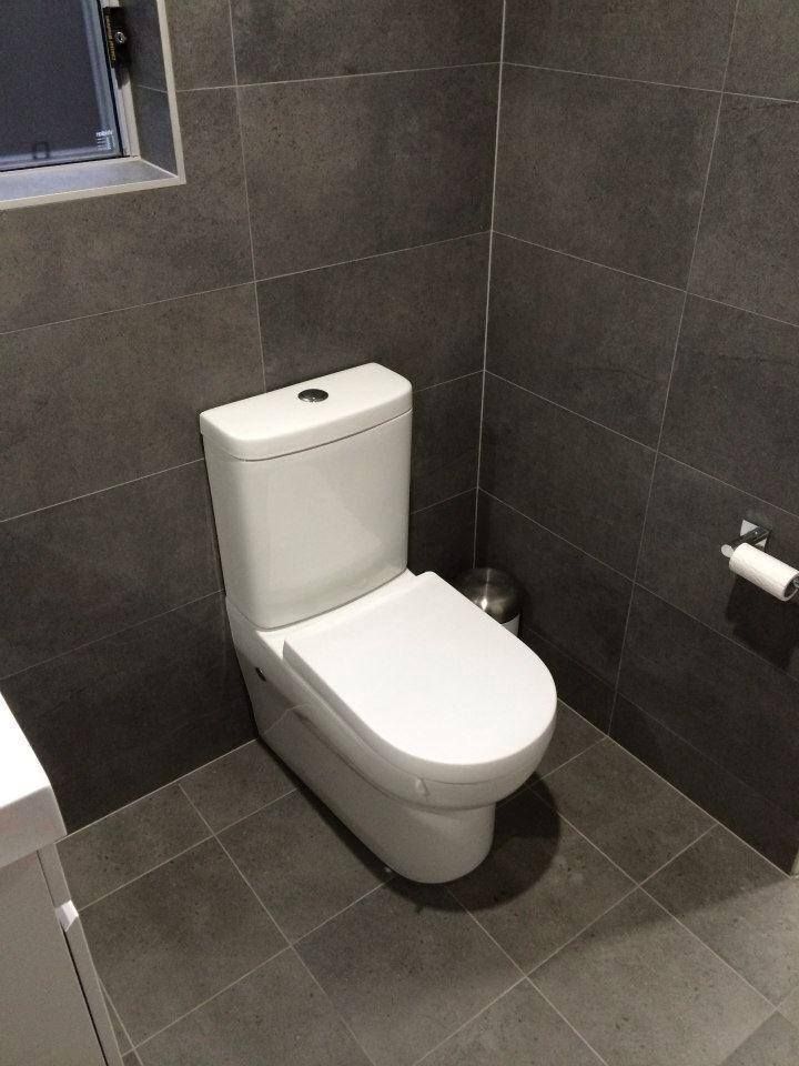 Minimalist Toilet design featuring clean lines and sleek aesthetics — Corrimal Discount Tiles and Bathroomwear in East Corrimal, NSW