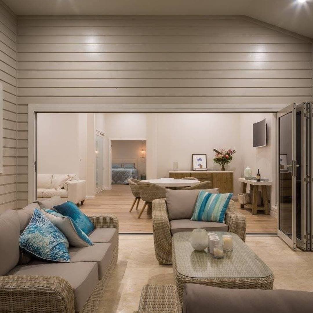Contemporary Living Room with a Wood and White Theme, showcasing elegant design — Corrimal Discount Tiles and Bathroomwear in East Corrimal, NSW