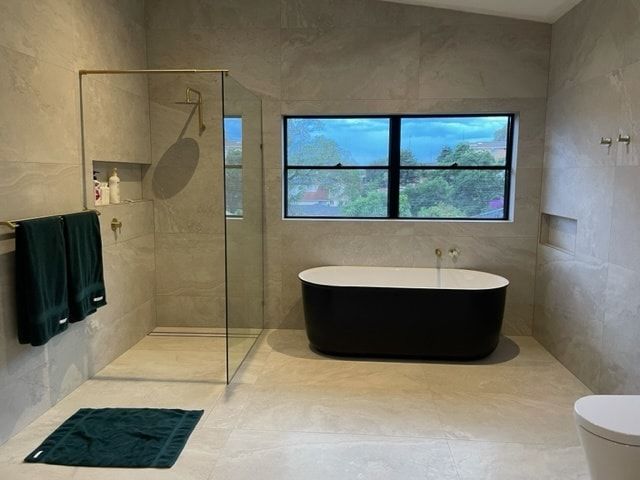 Bathroom vanity area showcasing elegant fixtures and tiles — Corrimal Discount Tiles and Bathroomwear in East Corrimal, NSW