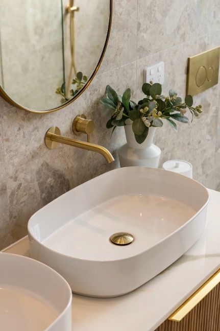A Bathroom with Two Sinks, A Mirror and A Vase of Flowers — Corrimal Discount Tiles and Bathroomwear in East Corrimal, NSW