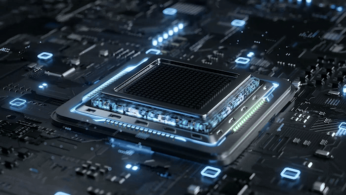 Close-up of a glowing computer processor on a circuit board, showcasing intricate details and blue lights.