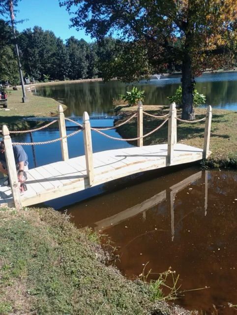 A small wooden bridge over a body of water