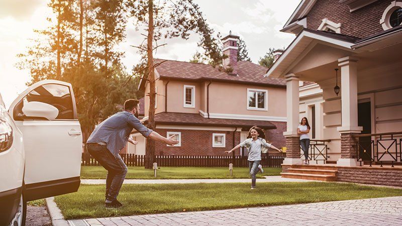young girl runs toward adult with outstretched arms