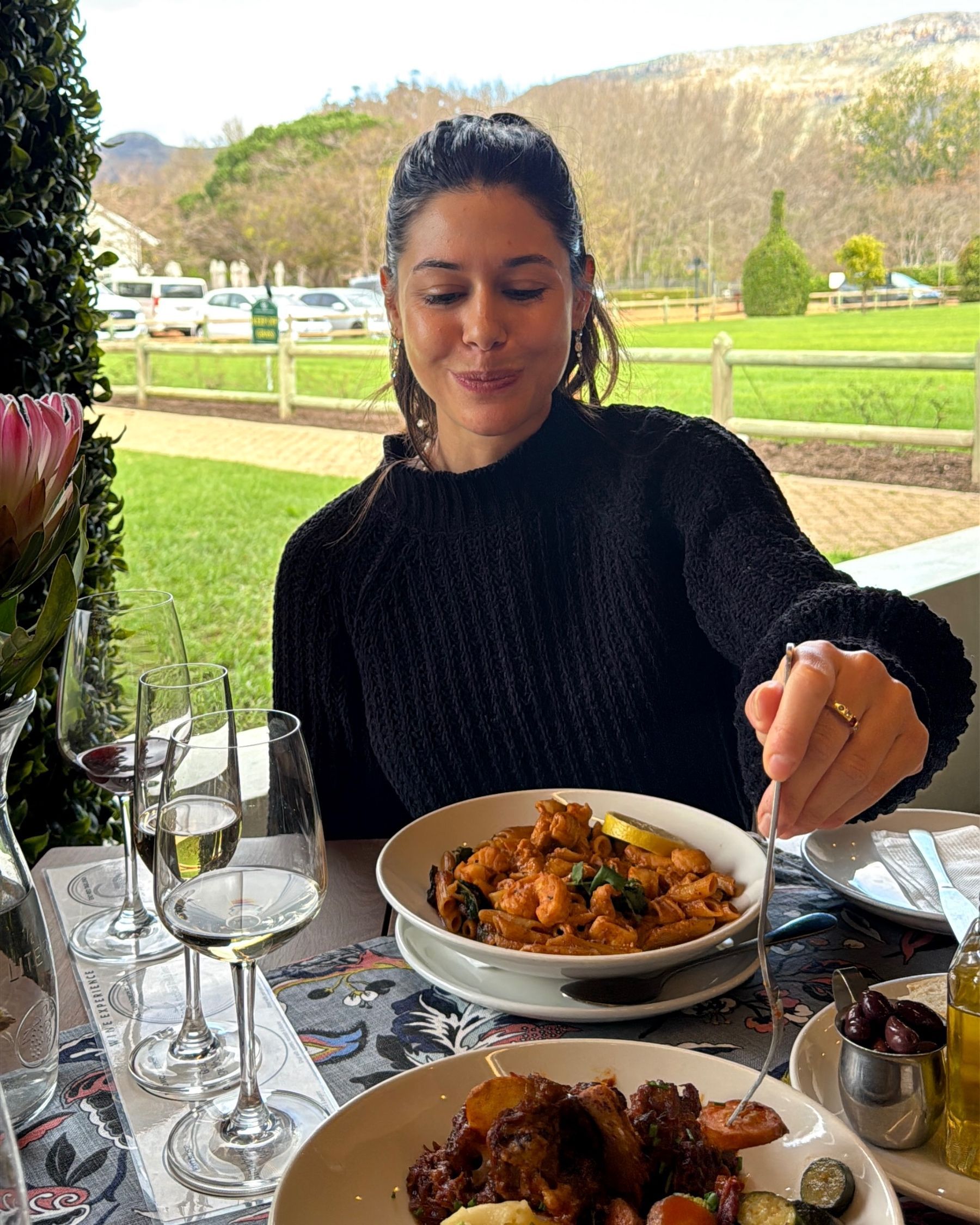 Paige is tasting oxtail at Chardonnay Deli Uitsig
