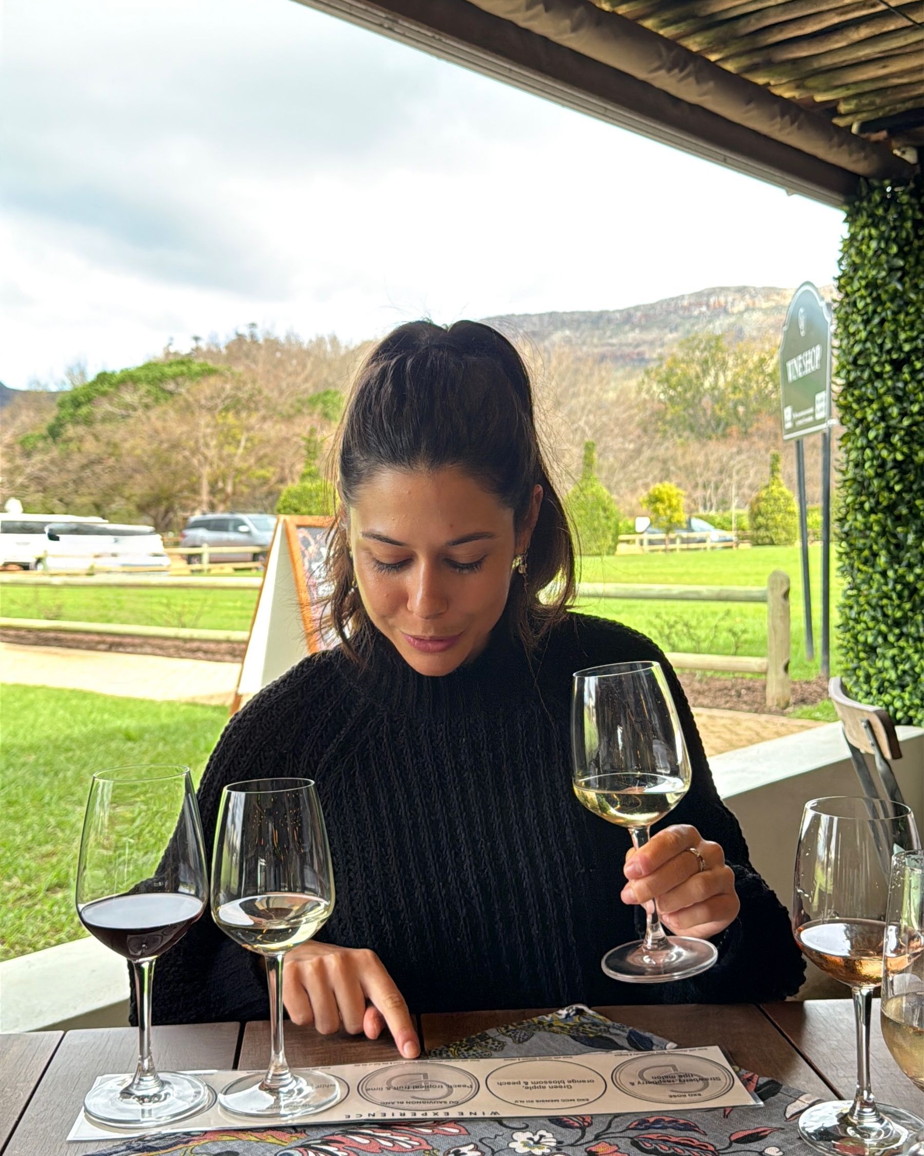 Paige is tasting wines at Chardonnay Deli Uitsig
