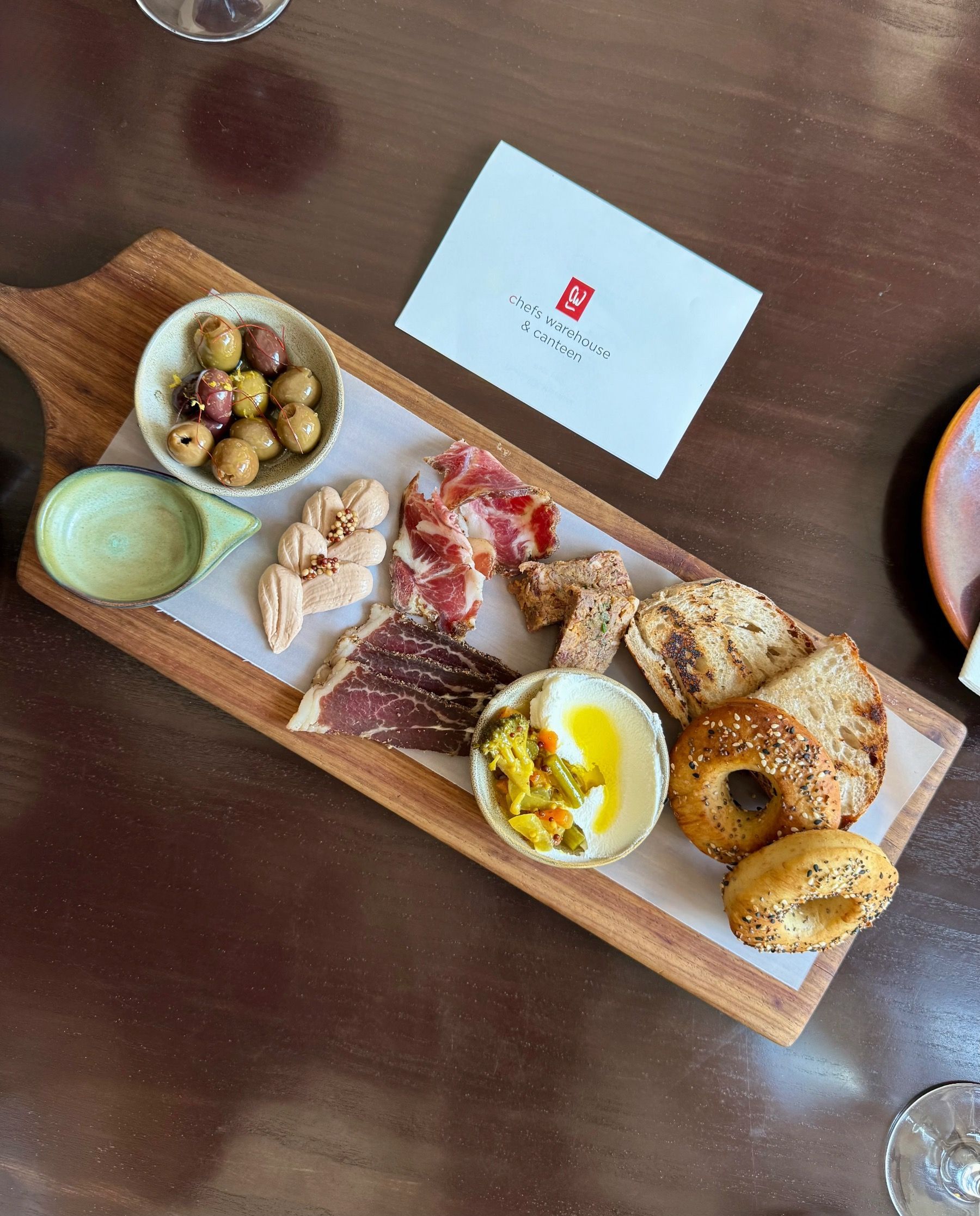 Charcuterie board with cured meats, cheeses, olives and artisan bread at Chefs Warehouse & Canteen Cape Town