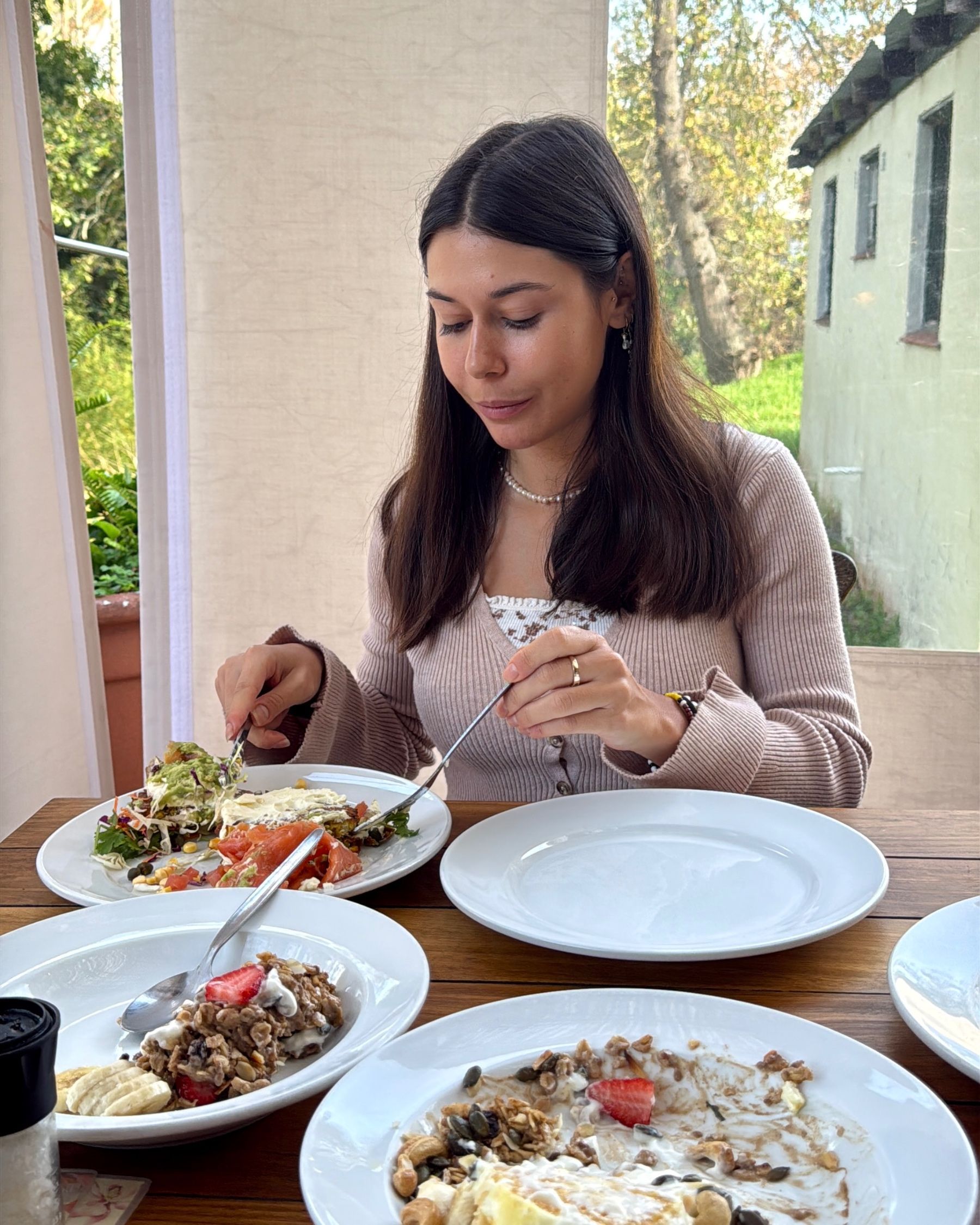 Paige sharing breakfast dishes at Chardonnay Deli High Constantia
