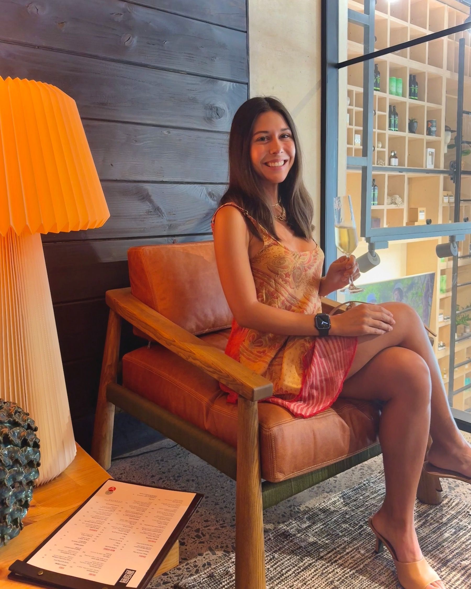 Paige Ellis Green sipping crisp, perfectly chilled bubbles in the East City Grill lounge area