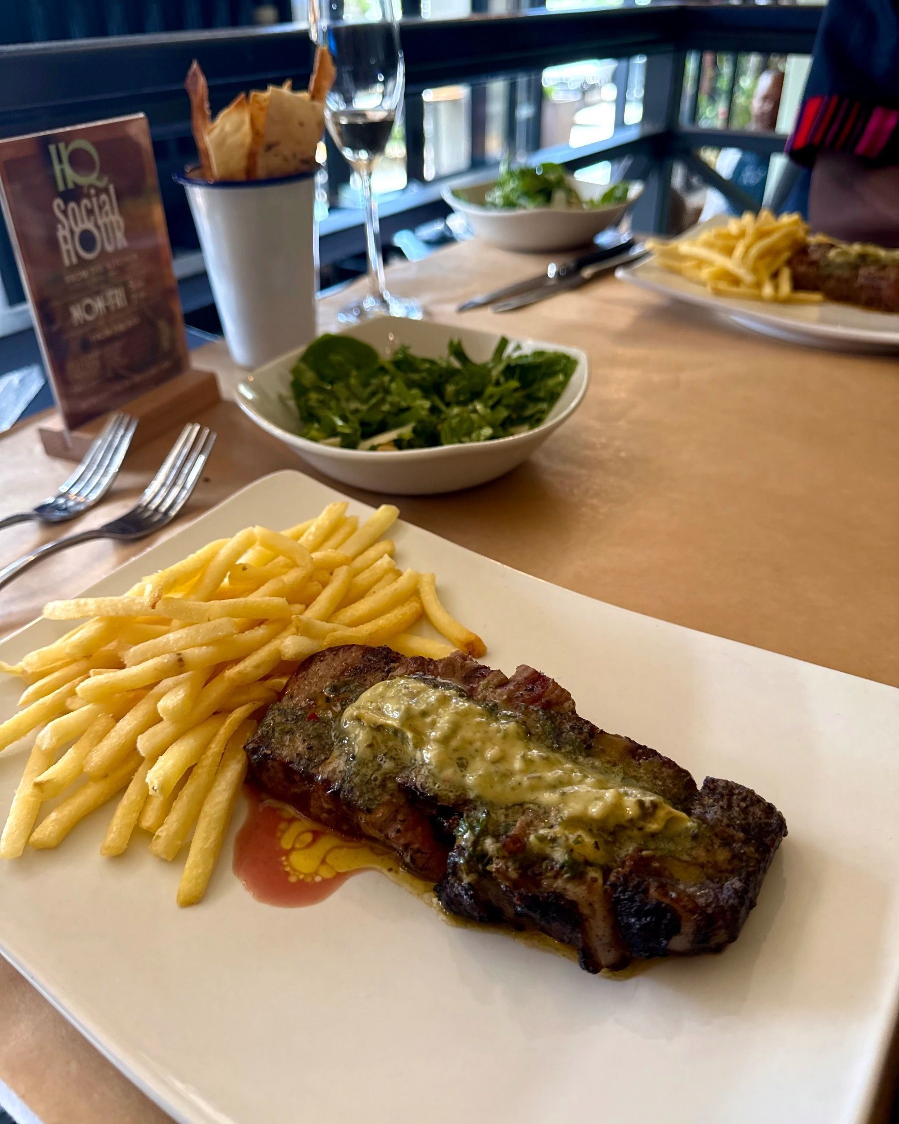 250g sirloin steak with Cape de Paris butter, fresh-cut fries and the signature HQ salad at HQ Steakhouse Century City