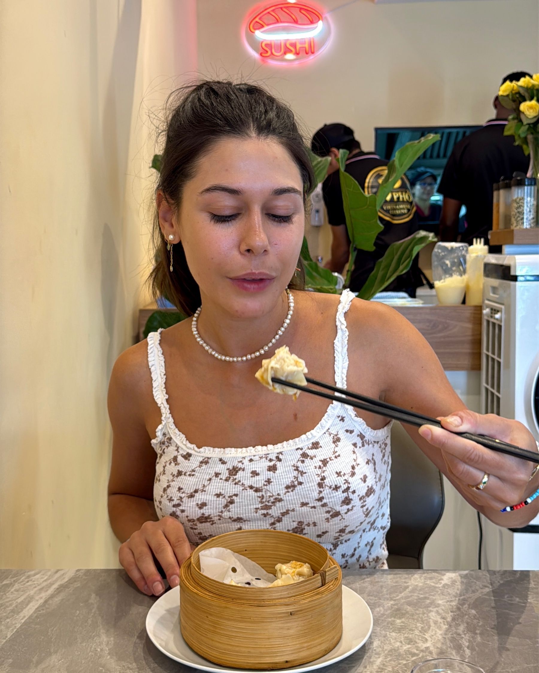 Paige eating prawn dim sum at I Love Pho