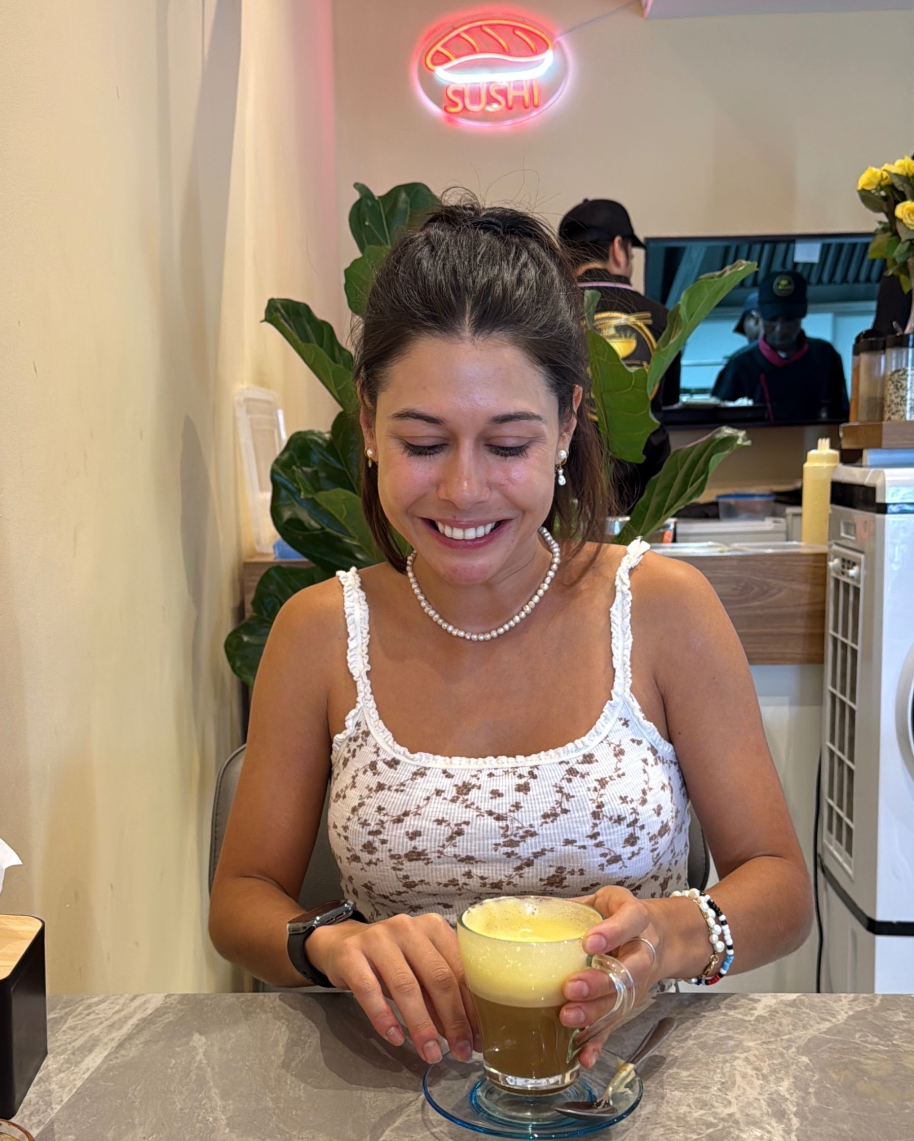 Paige drinking Vietnamese egg coffee at I Love Pho
