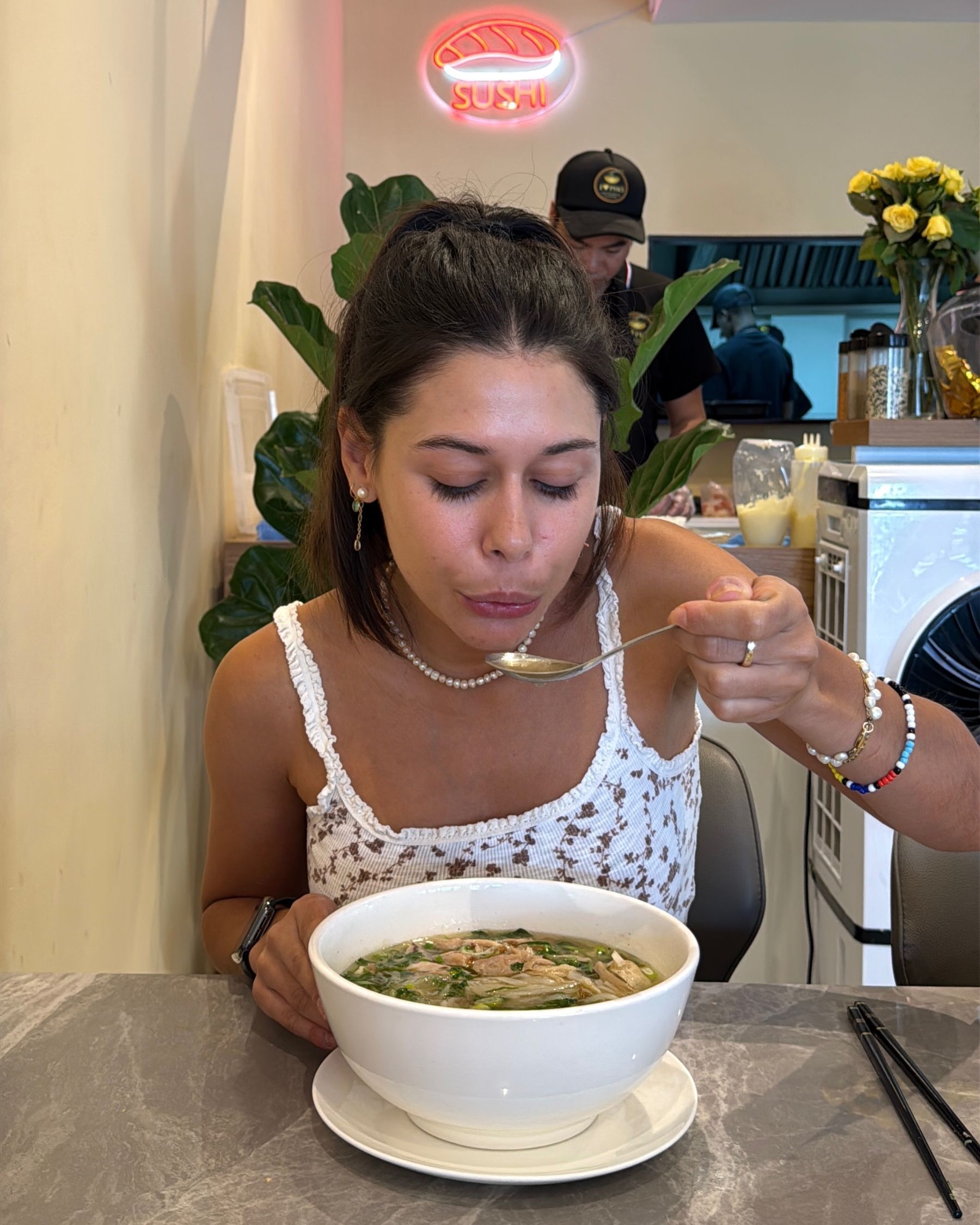 Paige eating chicken pho at I Love Pho Claremont