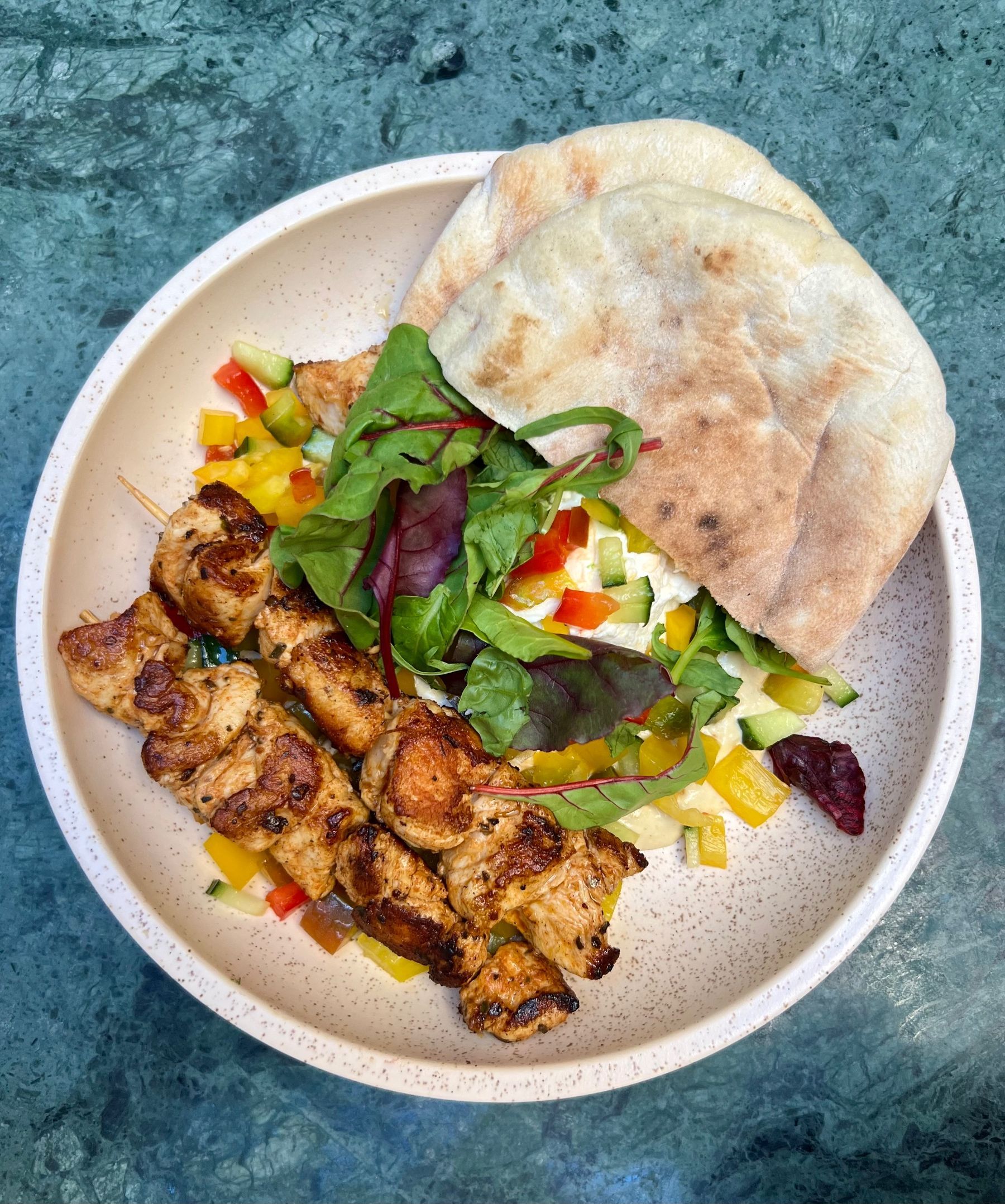 Jarryd’s gyro bowl with chicken skewers, pita and tzatziki