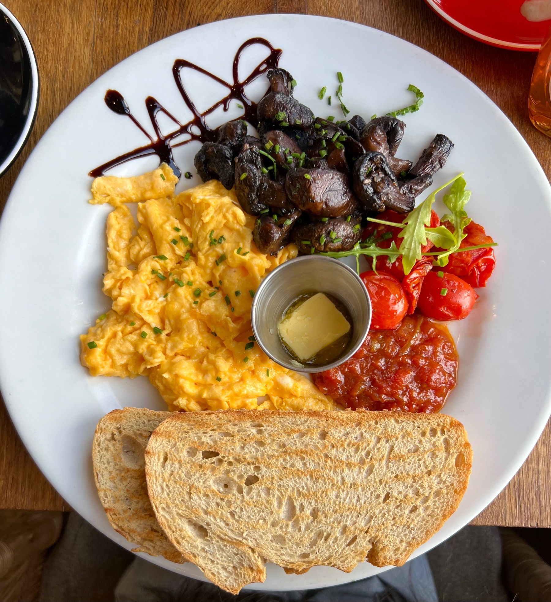 Han’s and Lloyd scrambled eggs with toast, mushrooms and tomatoes