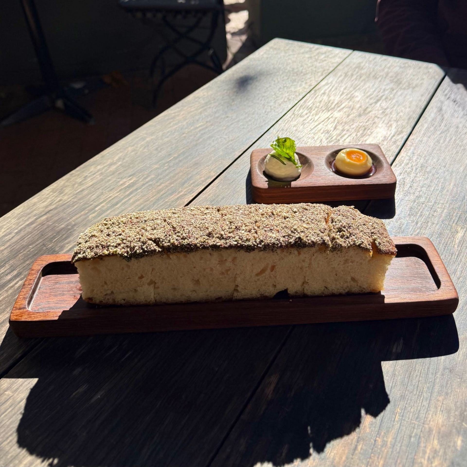 Complimentary focaccia with garlic labneh butter at Foxcroft Constantia