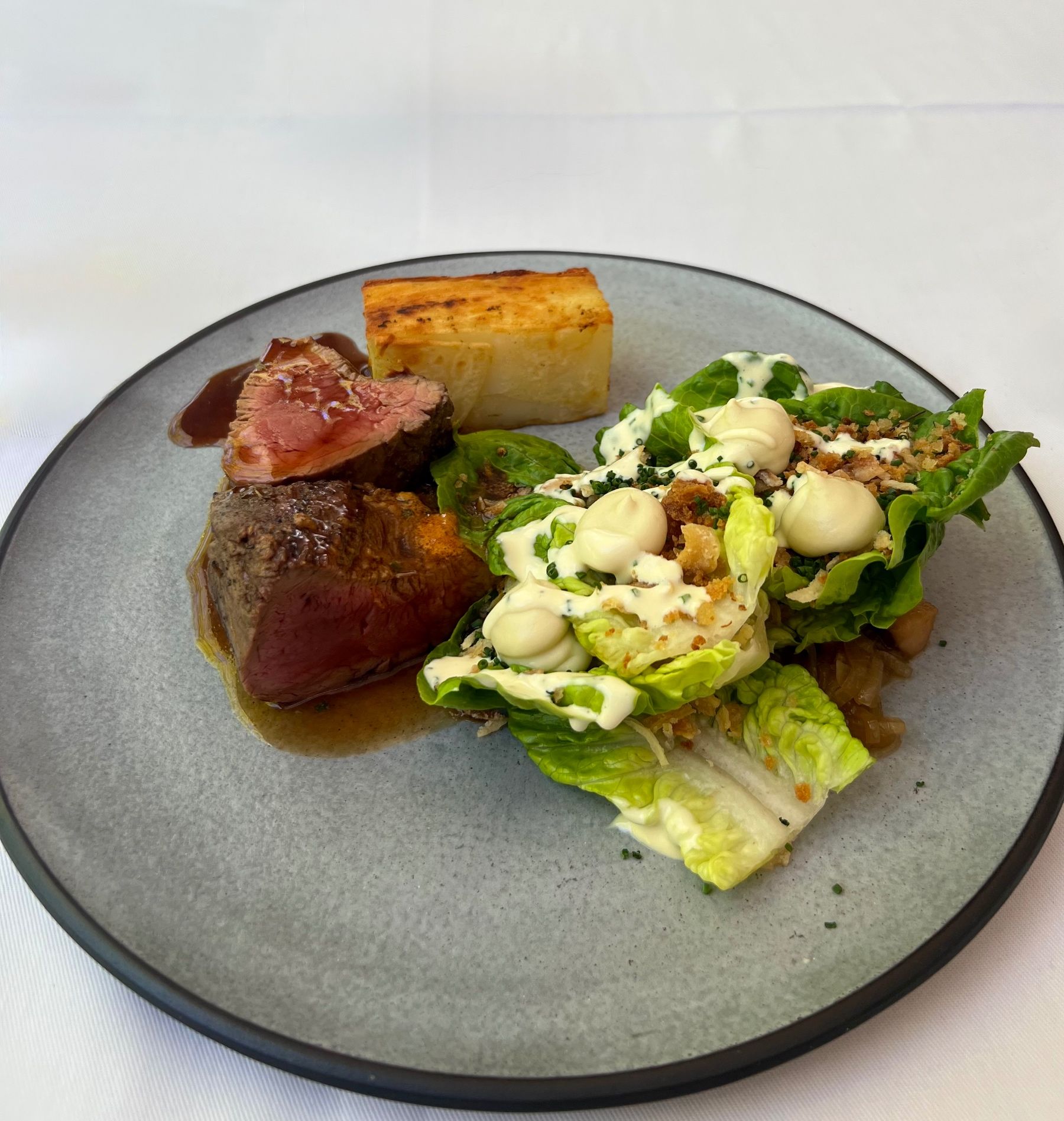Beyond Restaurant beef fillet with dauphinoise and Caesar wedge