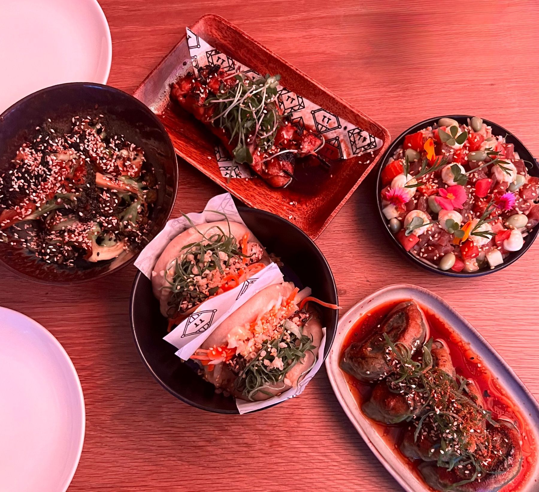 Tjing Tjing Tori with broccoli, gyoza, yakitori and bao, salmon poke