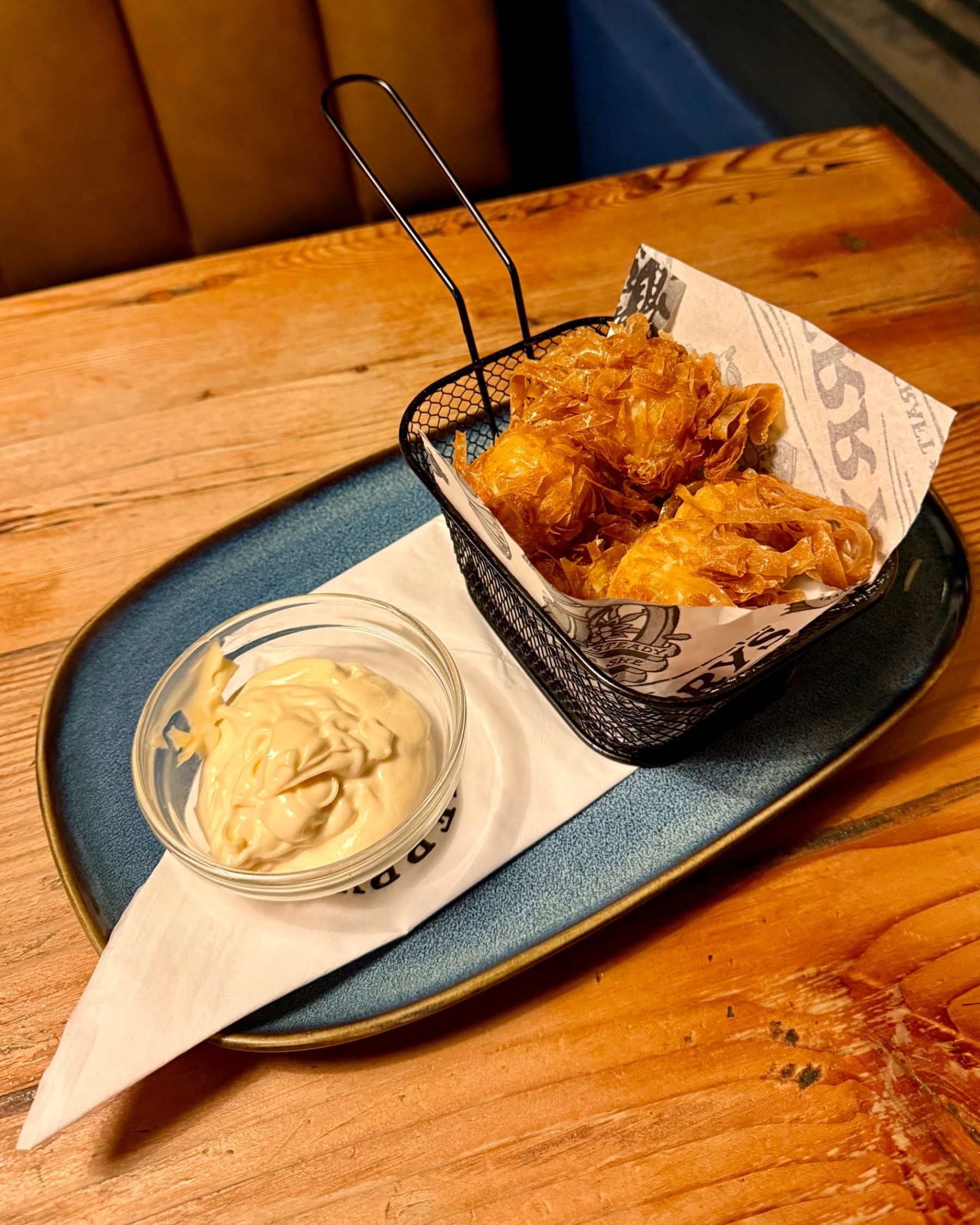Crispy cheese bombs served with dipping sauce
