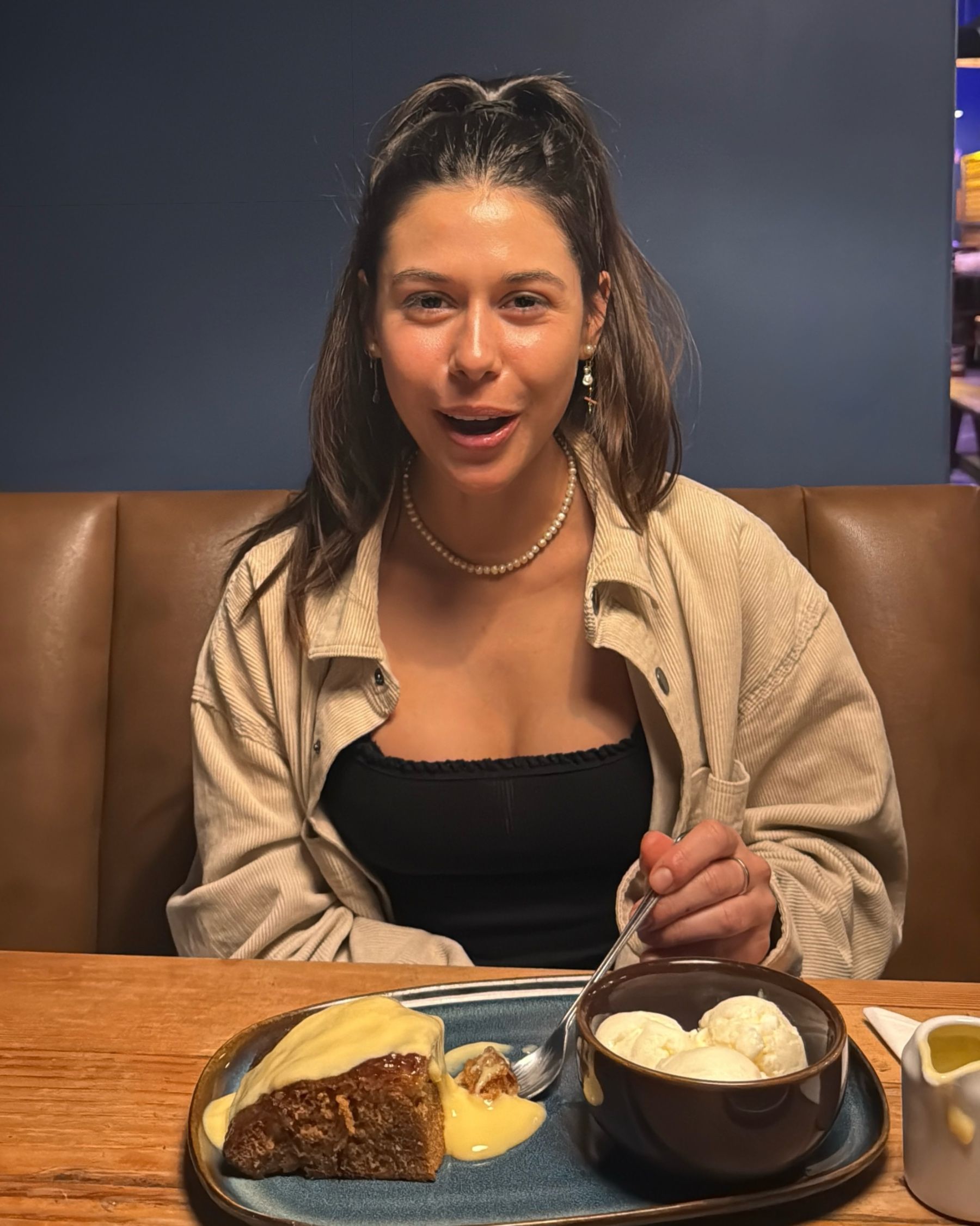 Paige eating malva pudding at Jerry’s
