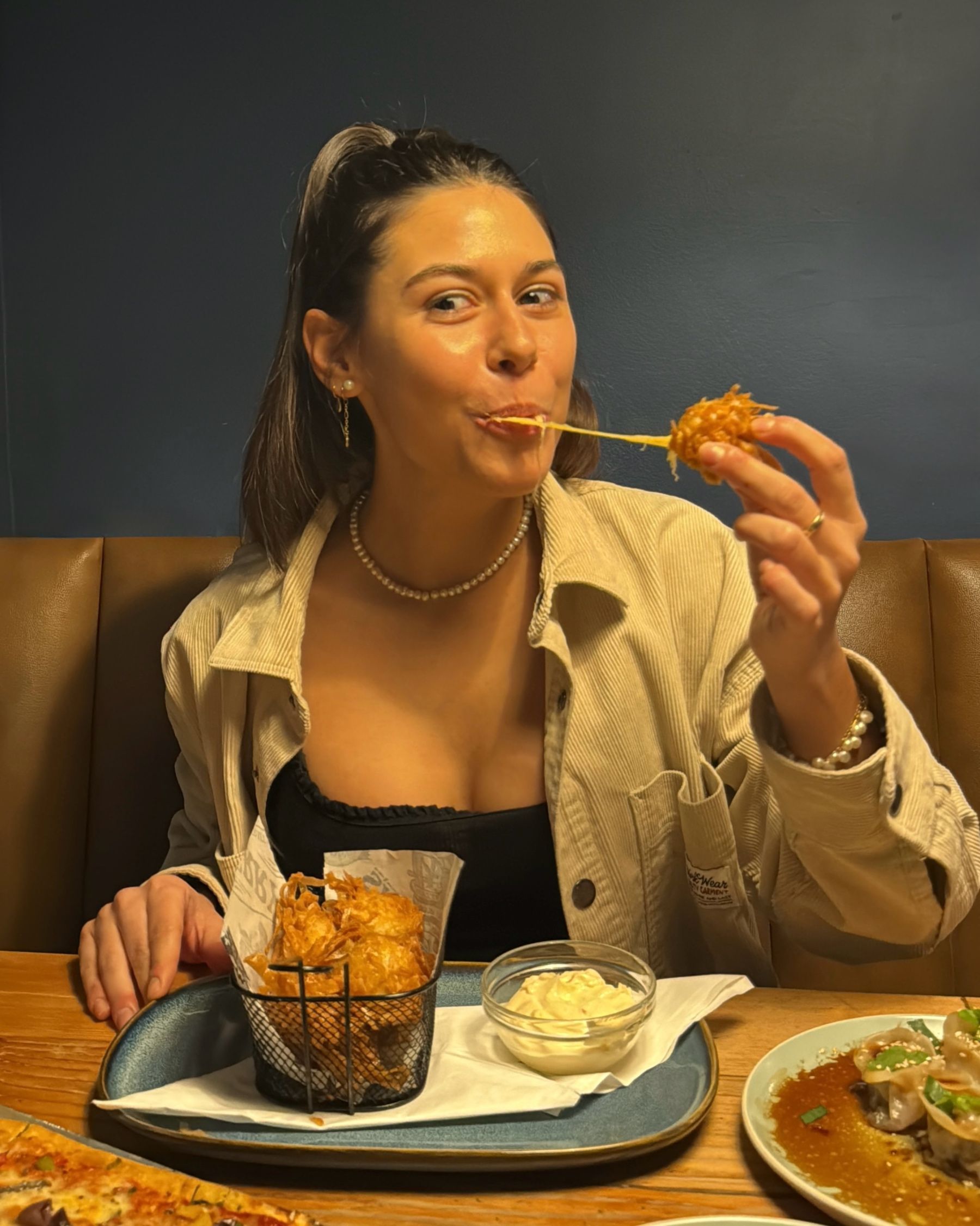 Paige eating a cheese bomb at Jerry’s
