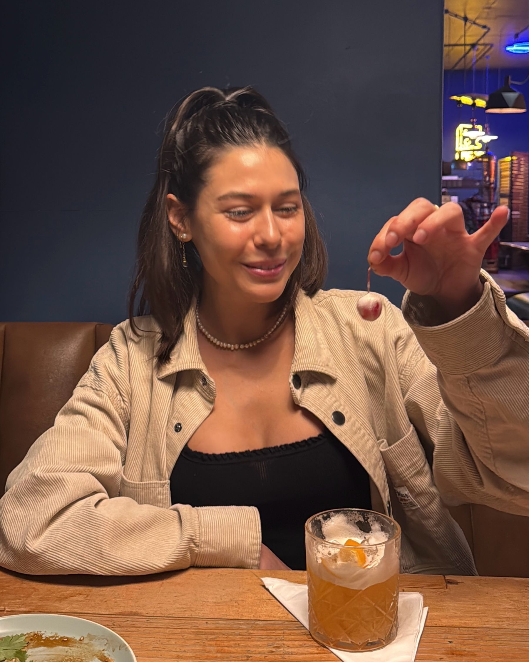 Paige drinking a Whiskey Sour cocktail
