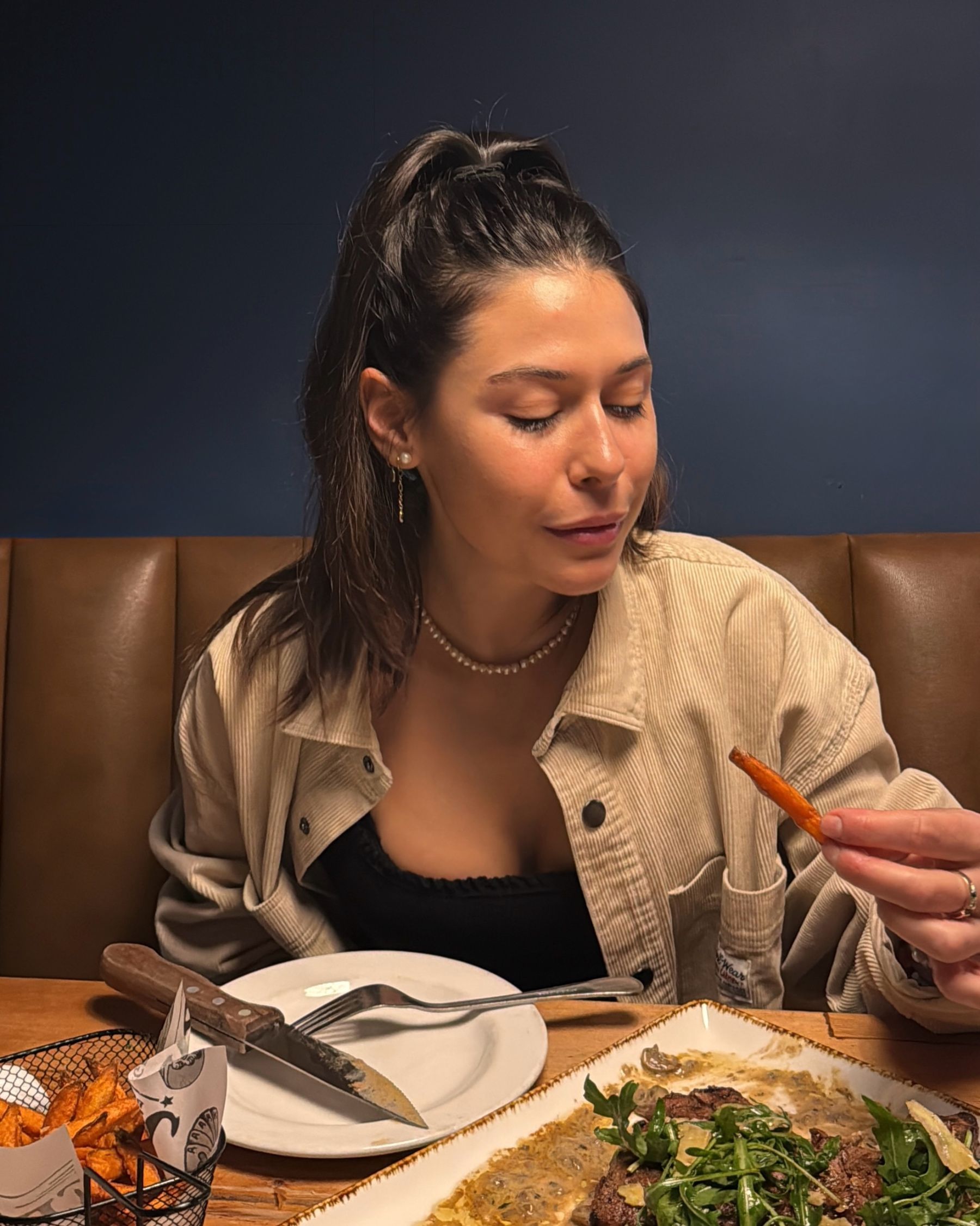 Paige enjoying sweet potato fries at Jerry’s
